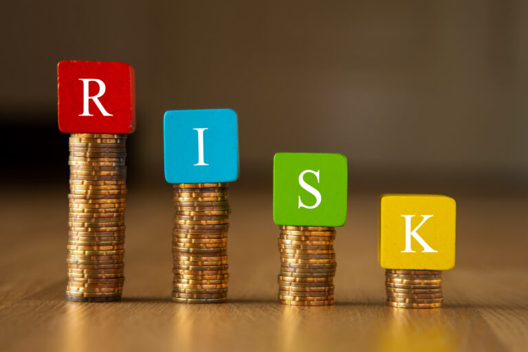 Why Software Outsourcing Fails financial risk wording on block